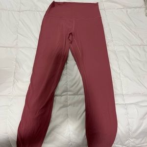 Size 6 lululemon align leggings in a pinkish/magenta color.